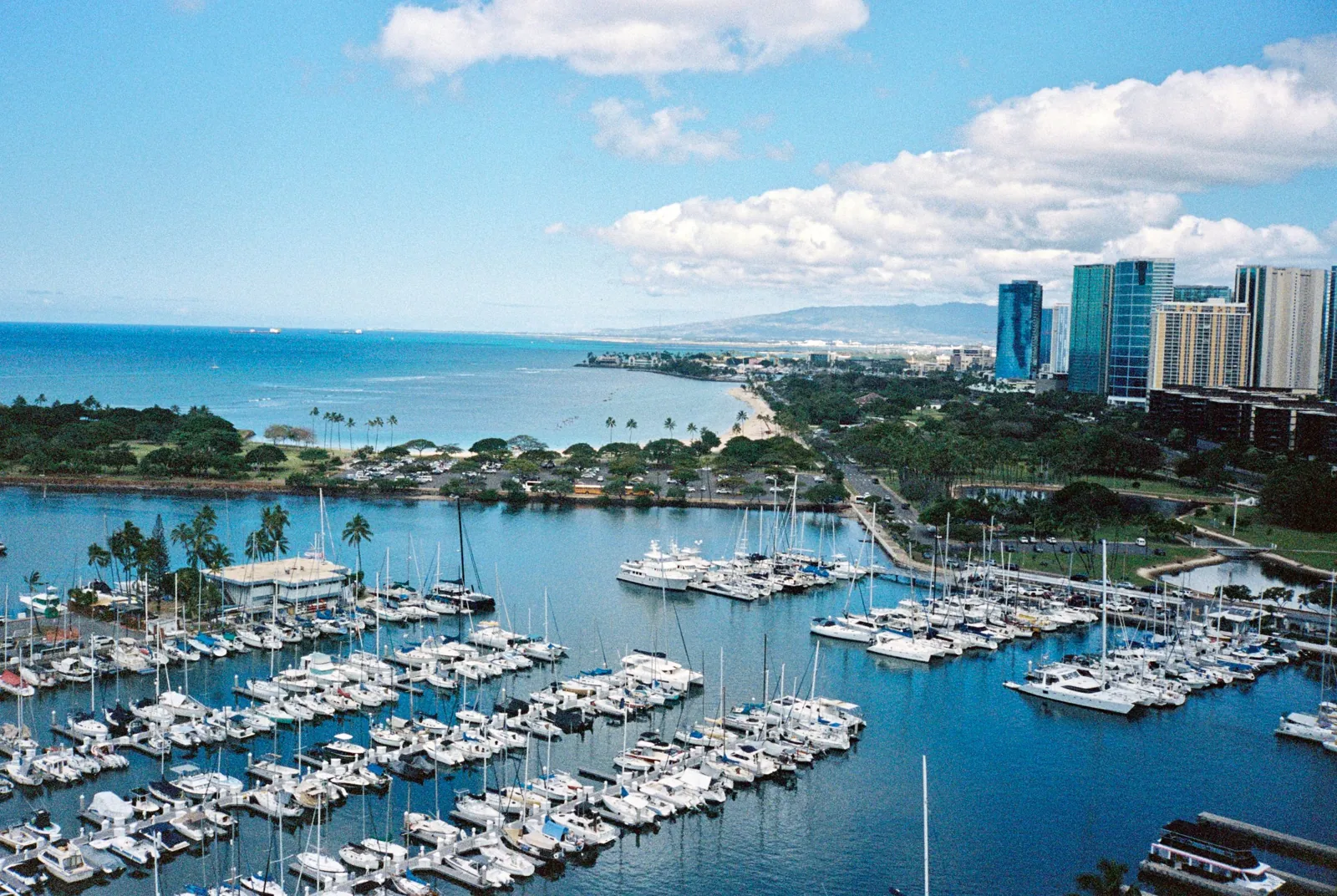 Aerial view of Ala Wai Harbor full of boats with the Honolulu skyline beyond, Oahu