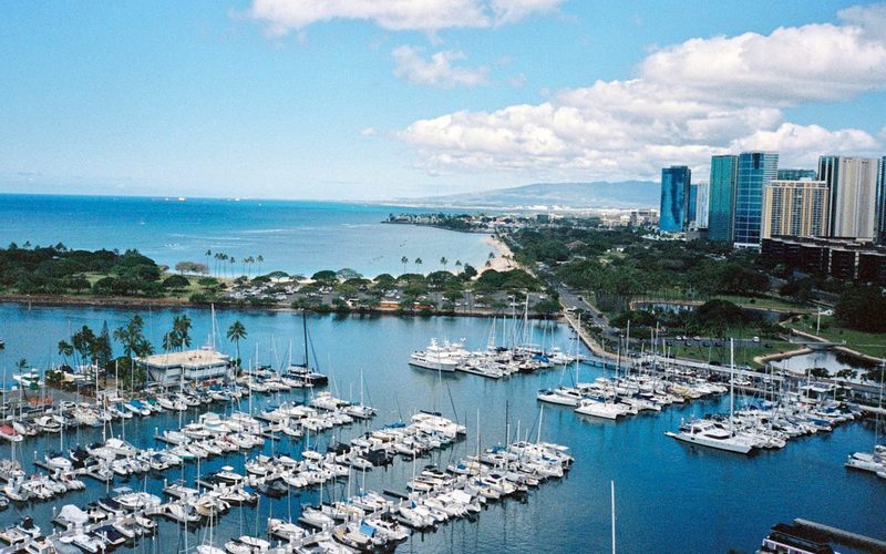 Aerial of the Ala Wai Harbor full of boats with Waikiki and the Honolulu skyline beyond, Oahu, Hawaii