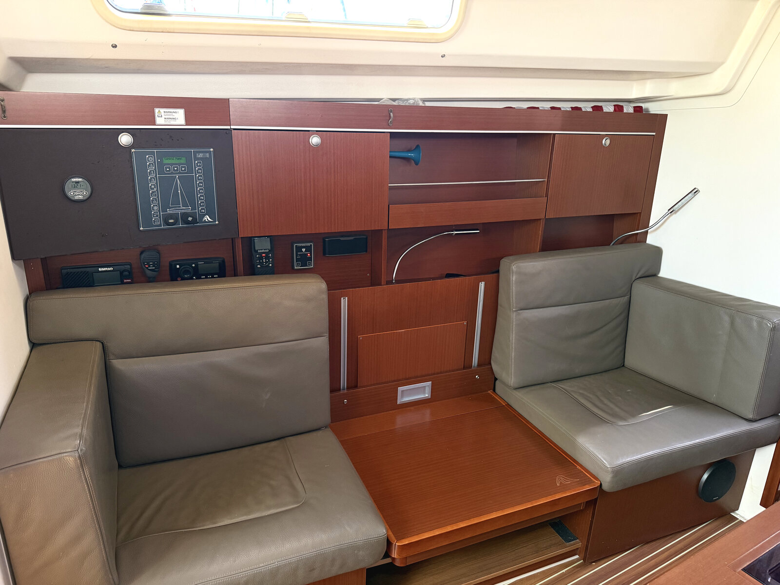 2014 Hanse 385 "Effortless" for sale, Honolulu Hawaii &mdash; Nav station and facing settees (photo 19 of 29)